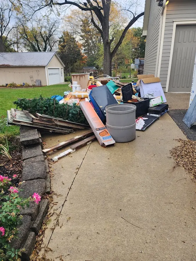 Dumpster being loaded with debris for Commercial Dumpster Rental in Glasgow